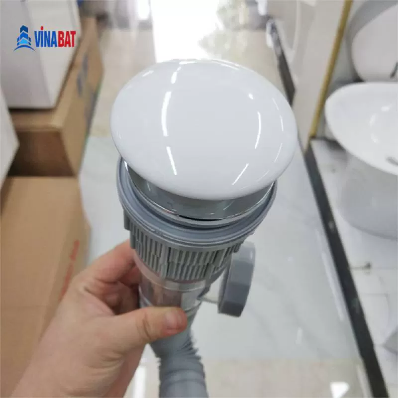 Bộ xi phông nhựa đầu sứ nhấn có rọ rác tách rời